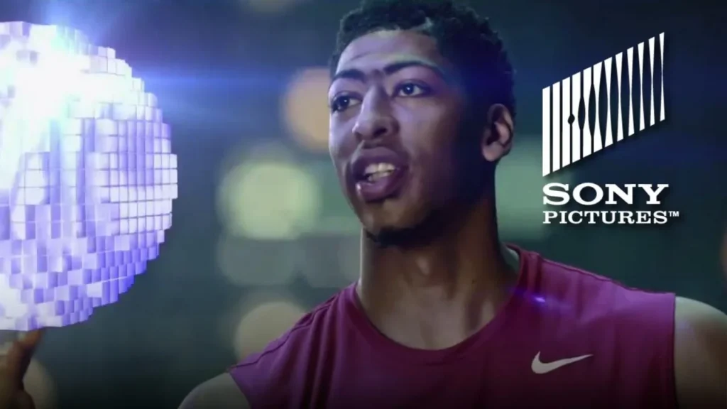 Anthony Davis in a purple basketball jersey in a Pixels commercial still.
