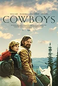 Cowboys film poster with two figures on horseback in a mountain landscape.