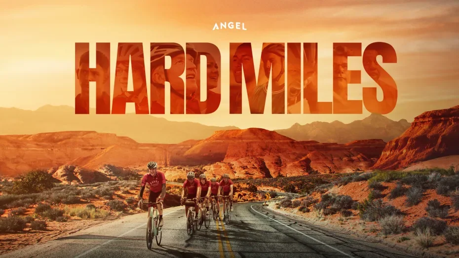 Official Hard Miles artwork showing cyclists on a desert road.