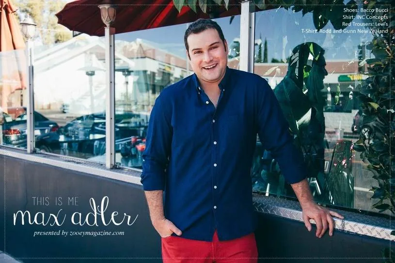 Magazine editorial portrait with short styled hair and a blue shirt.